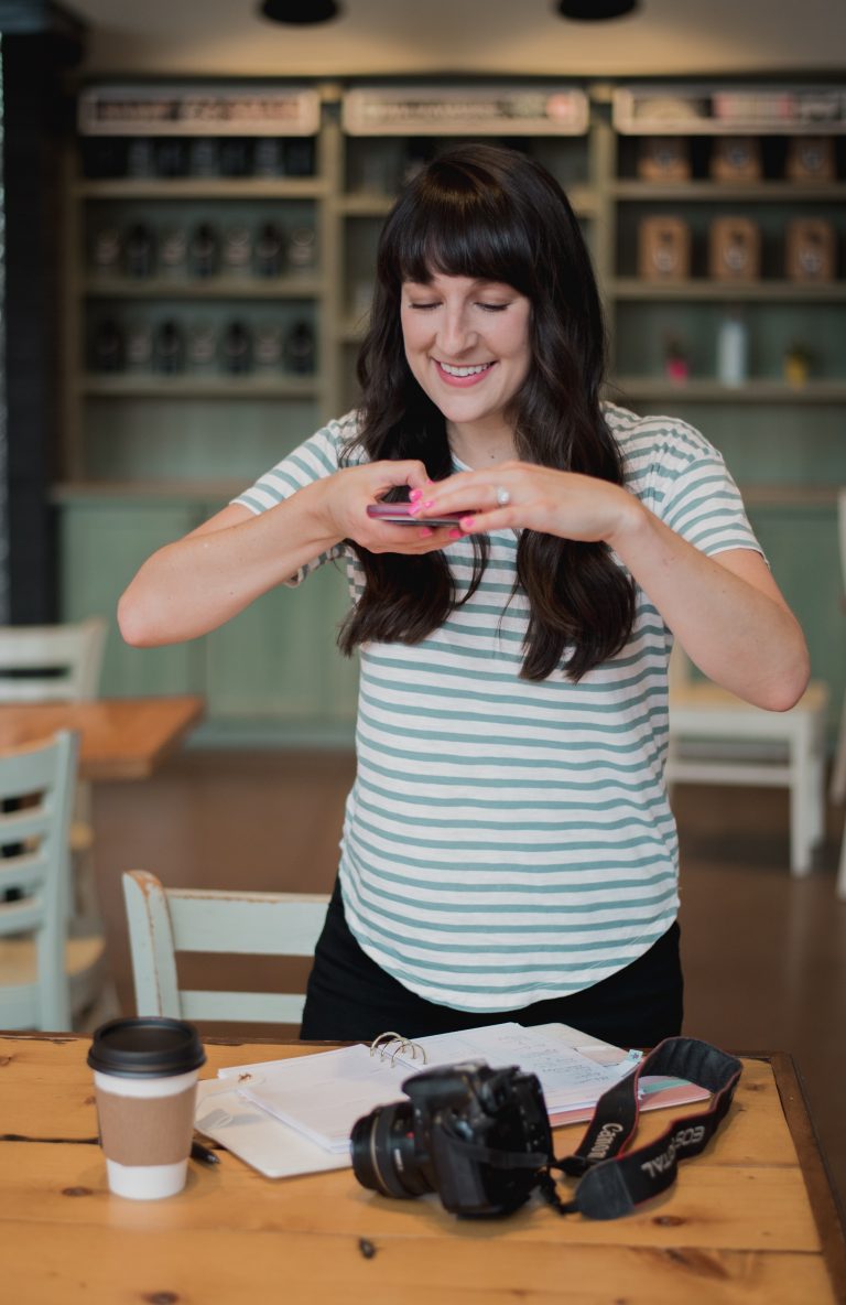 liz taking a photo with her phone